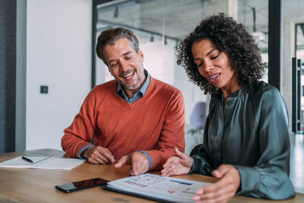 Two business professionals discussing project
