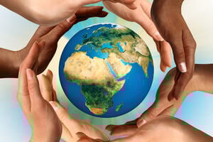 Hands forming a circle around a globe.