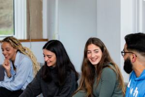 Photograph of 4 young people chatting